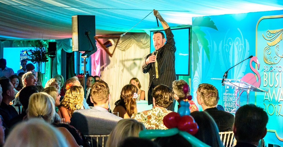 Paul Zenon literally swinging a pint of beer around everyone's heads Title Sussex Magazine www.titlesussex.co.uk