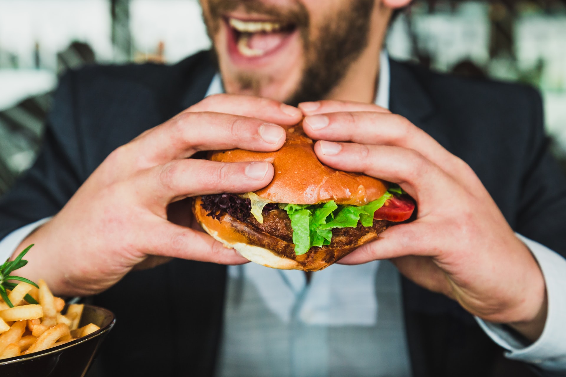 man eating burger