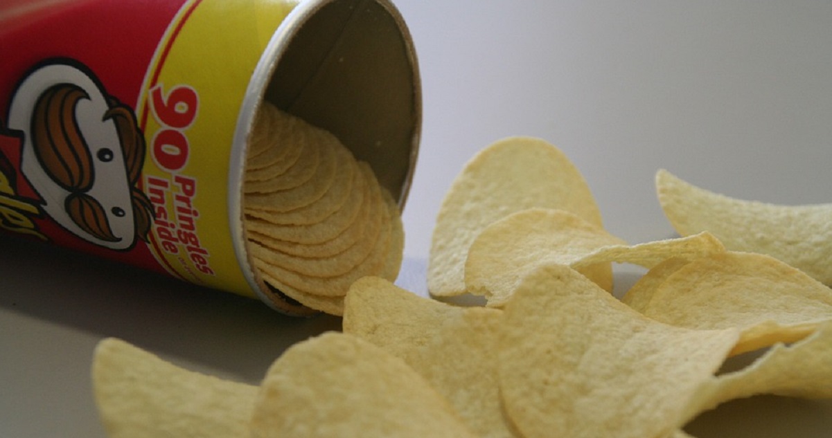 tube of pringles on its side with crisps spilling out - article for title sussex www.titlesussex.co.uk (002)