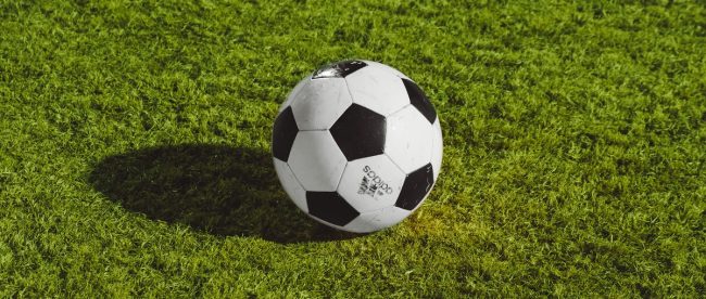 Adidas football on pitch for www.titlesussex.co.uk
