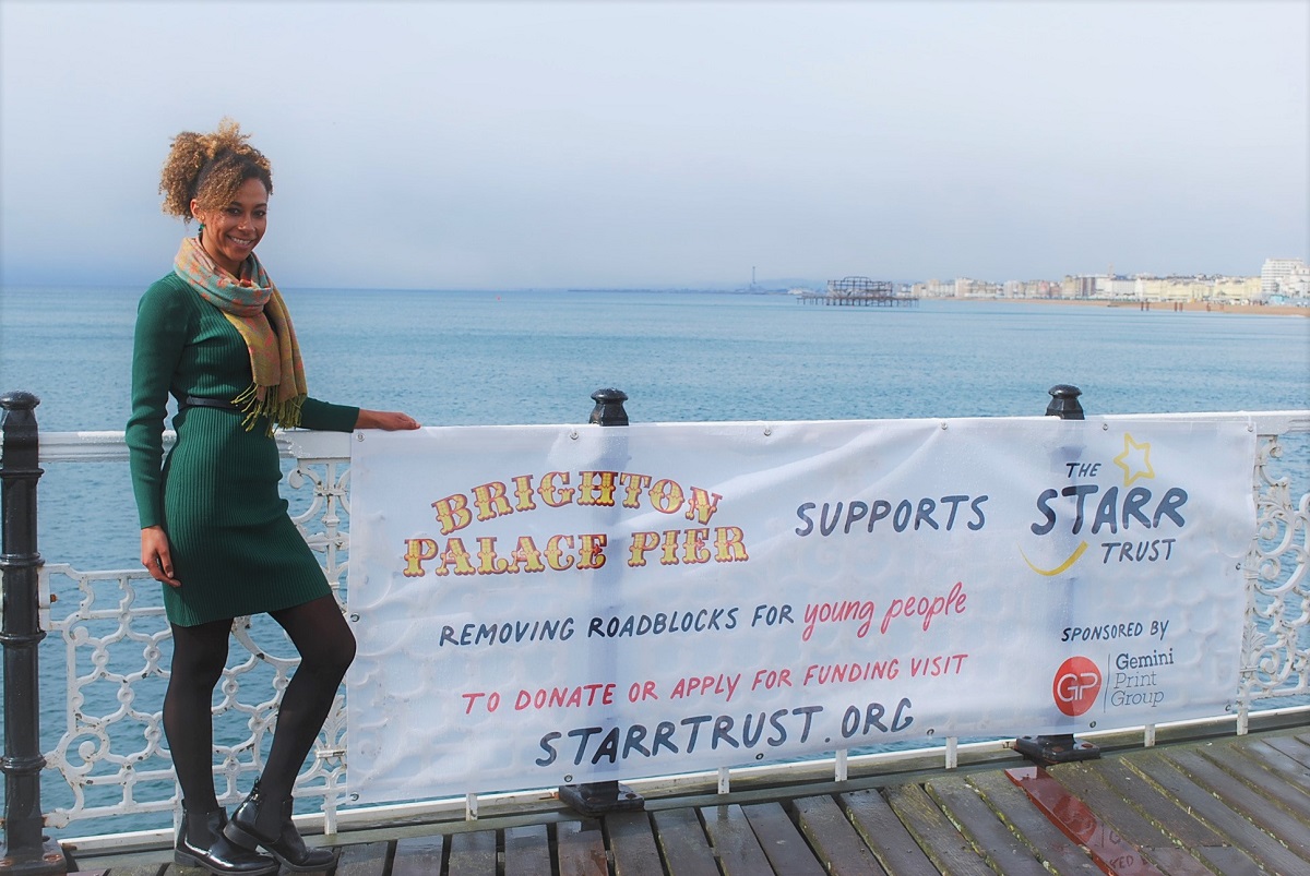 Stephanie of Healys Solicitors with New Starr Trust Banners on the pier for Title Sussex www.titlesussex.co.uk