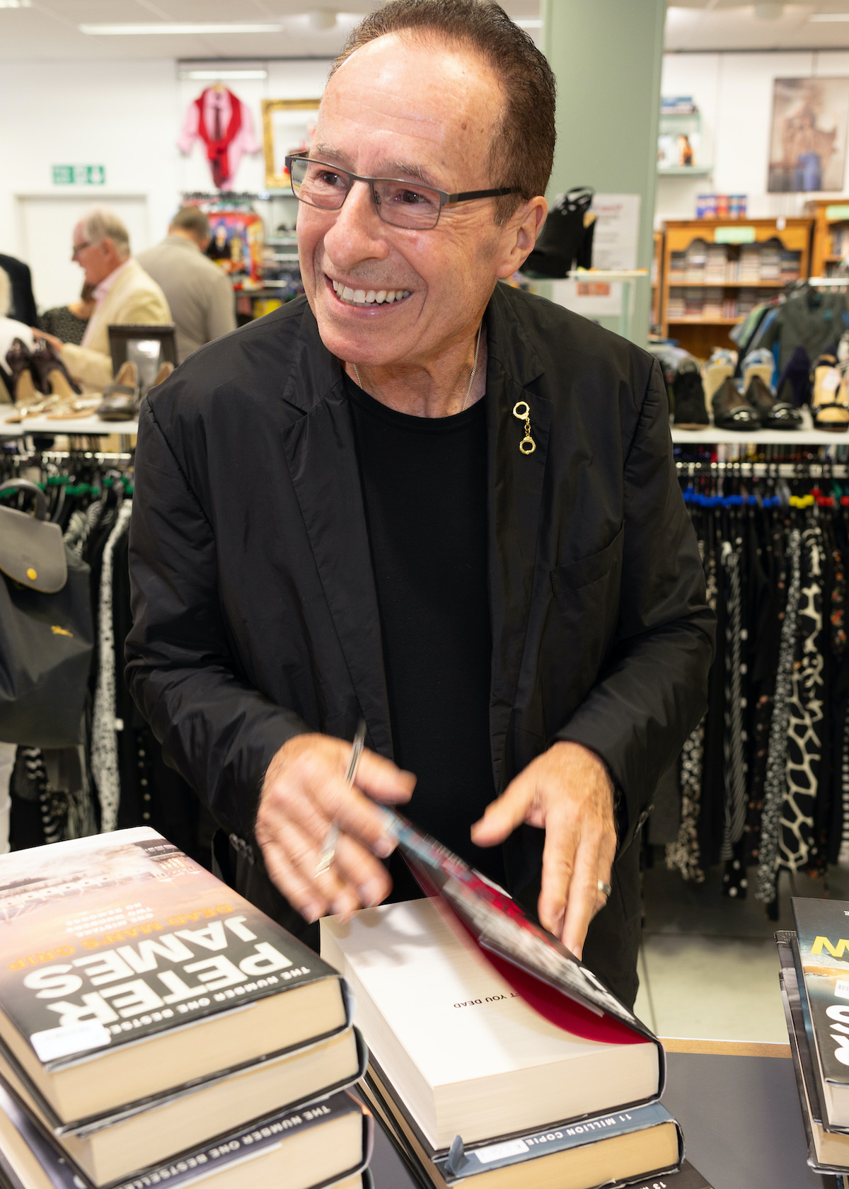 Peter James singing his books in the shop.
