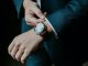 Image shows a close up of a man's wrist with a fancy watch on
