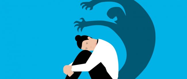 Physical injury affects mental health article on Title Sussex Magazine Graphic showing woman sitting on floor looking sad whilst her shadow behind her is kind of evil looking