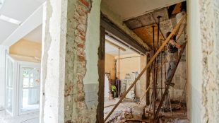 Image shows a kitched ripped out in the process of renovations