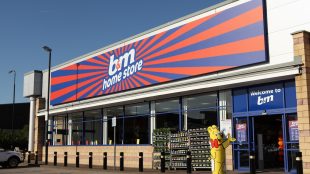 Bright B & M store front, orange and blue sign, under a blue sky. B&M Worthing store set to open in February 2024