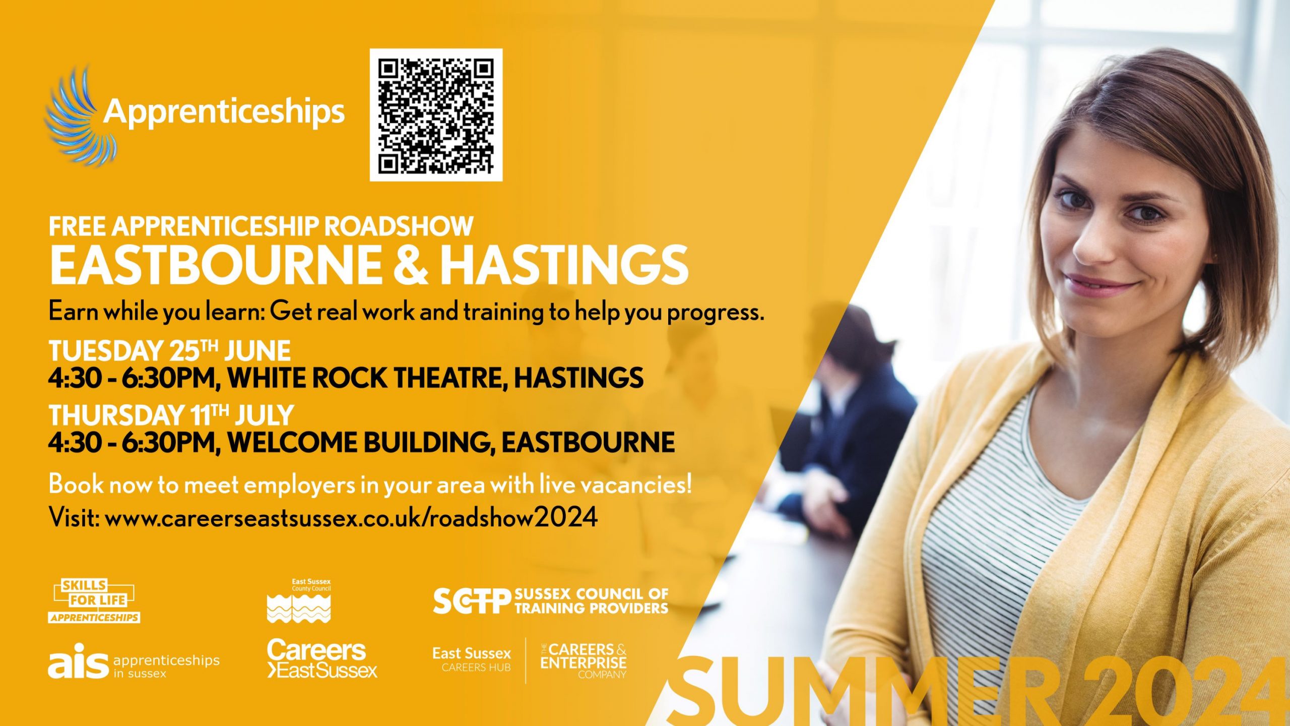 A women dressed in a yellow cardigan, standing next to the established information of the Sussex Apprenticeship Roadshow events.