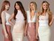 The image is the girl group girls aloud. They are all wearing pink/beige outfits and are stood in a line.